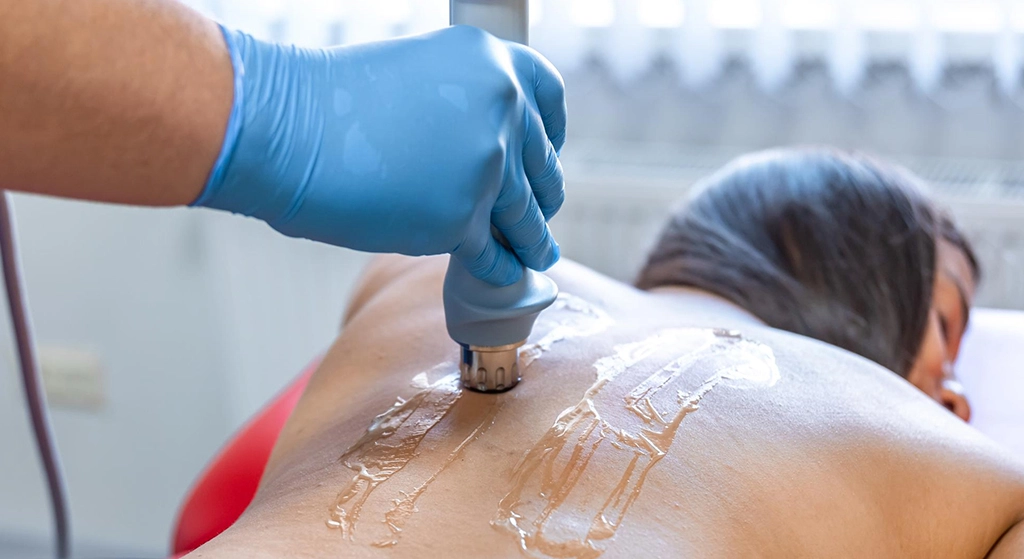 Shockwave therapy applied to patient’s lower back